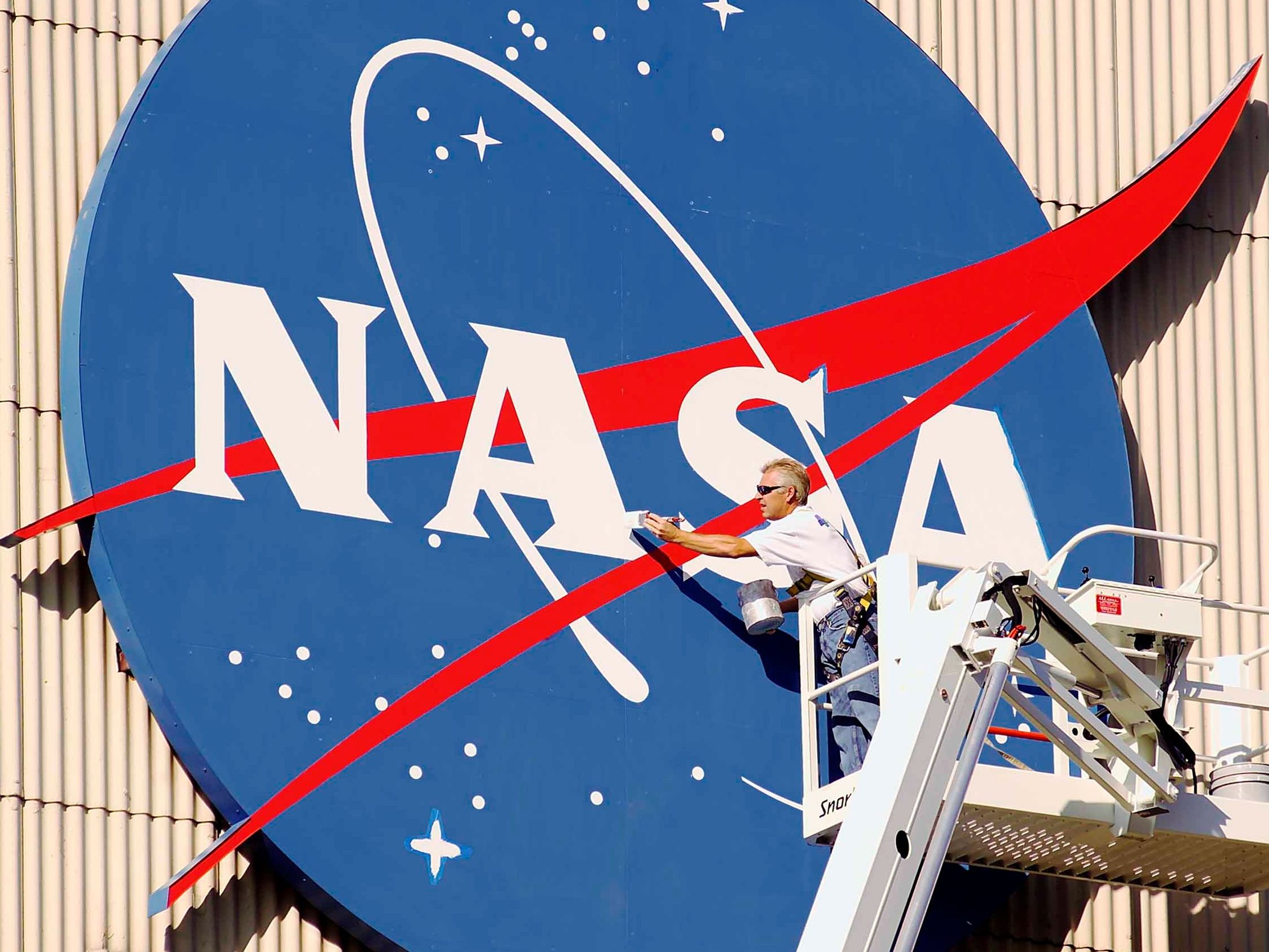 NASA Logo and Space Program Facility